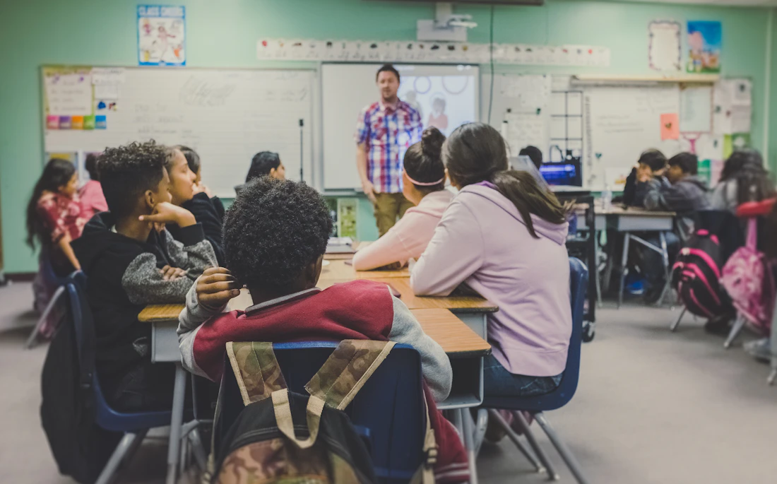 Students learning English together in a modern classroom